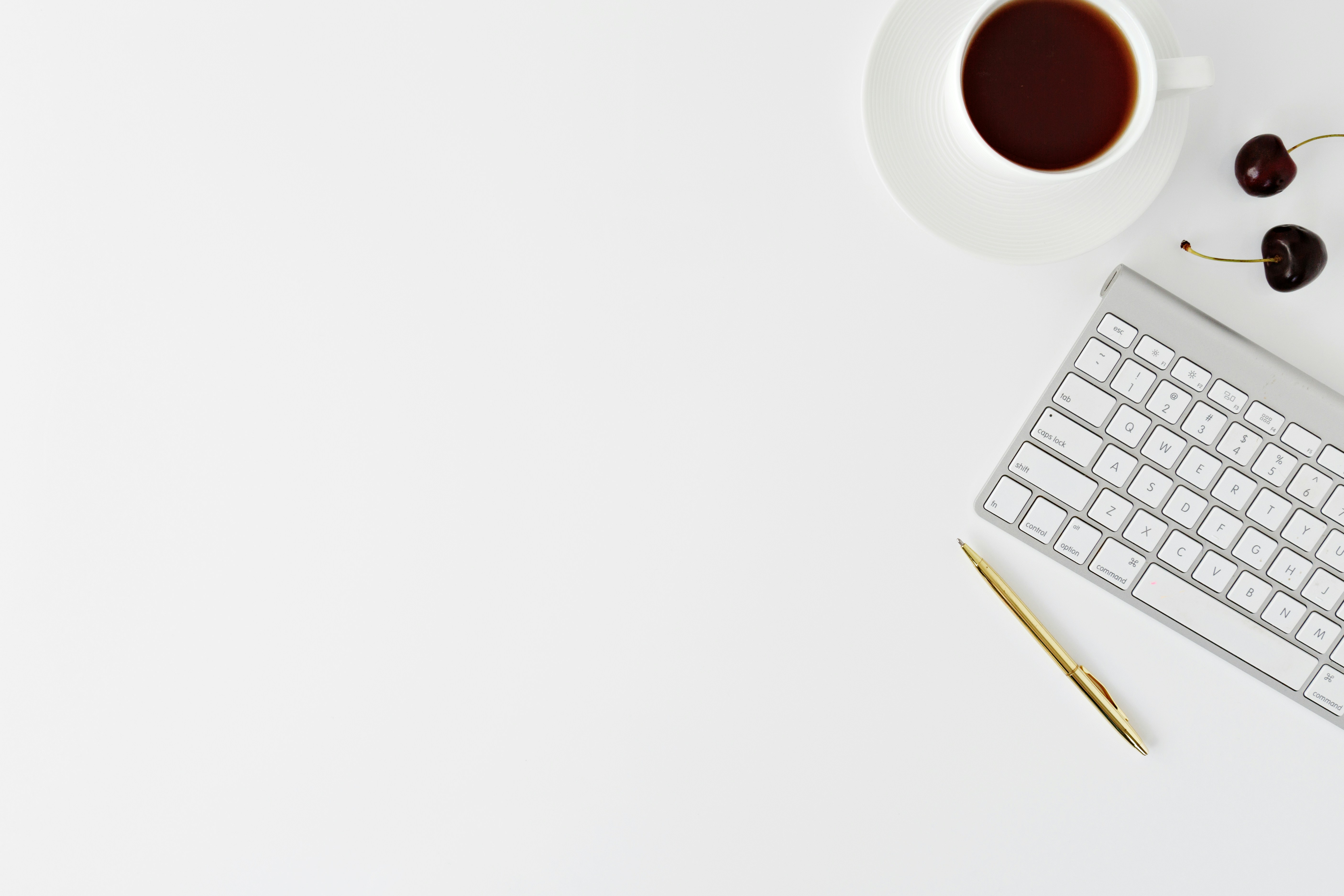 Minimalist office setting with laptop and coffee